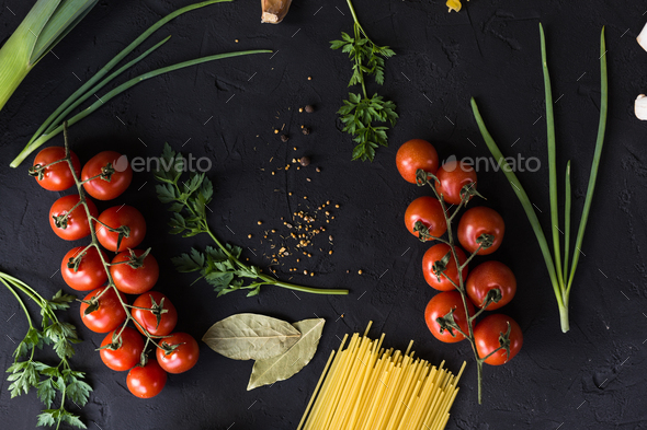 Fresh ingredients for cooking pasta, tomatoes, onions, garlic, herbs - Stock Photo - Images