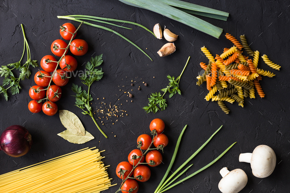 Fresh ingredients for cooking pasta, tomatoes, onions, garlic, herbs - Stock Photo - Images