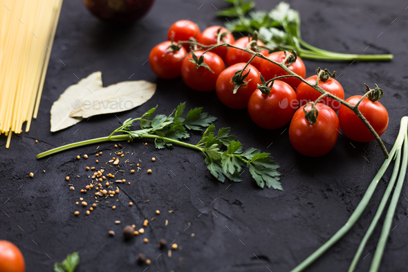 Fresh ingredients for cooking pasta, tomatoes, onions, garlic, herbs - Stock Photo - Images