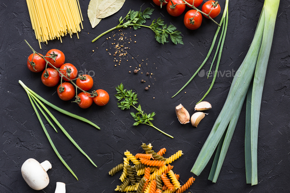 Fresh ingredients for cooking pasta, tomatoes, onions, garlic, herbs - Stock Photo - Images