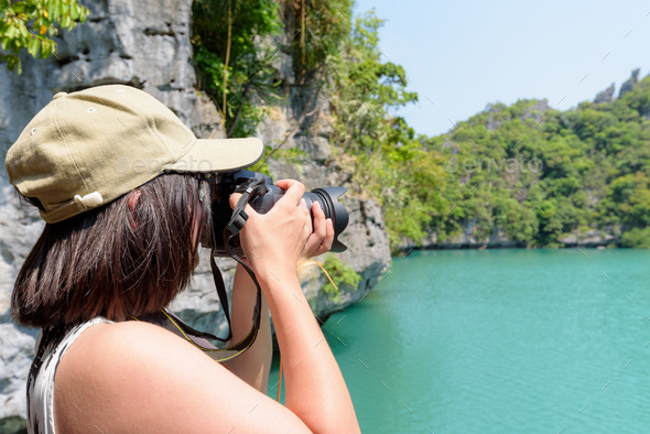 Woman tourist taking photos Thale Nai - Stock Photo - Images