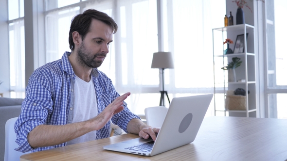 Loss, Frustrated Casual Beard Man Working on Laptop alt