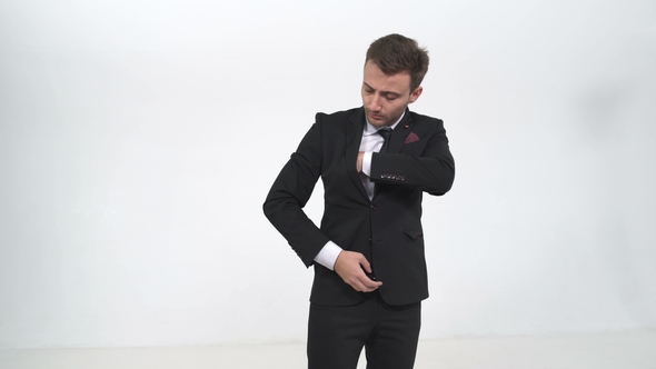 The Businessman Takes Out Money From His Pocket and Extends It To the Camera alt