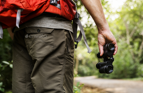 Man holding binoculars in the forest Stock Photo by Rawpixel | PhotoDune
