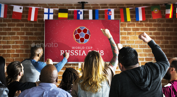 Cheerful supporters watching football at the pub Stock Photo by Rawpixel