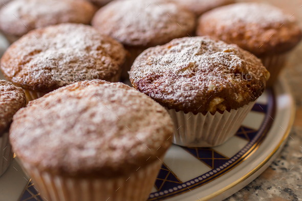 Batch of homemade freshly baked cupcakes or muffins - Stock Photo - Images