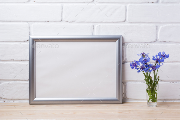 Silver landscape frame mockup with cornflower - Stock Photo - Images