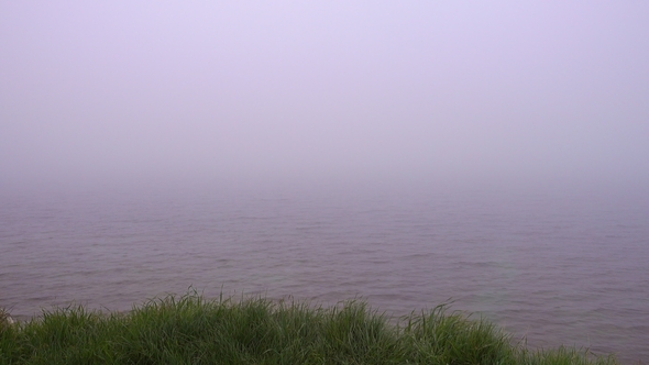 Dense Fog Over Calm Water Surface