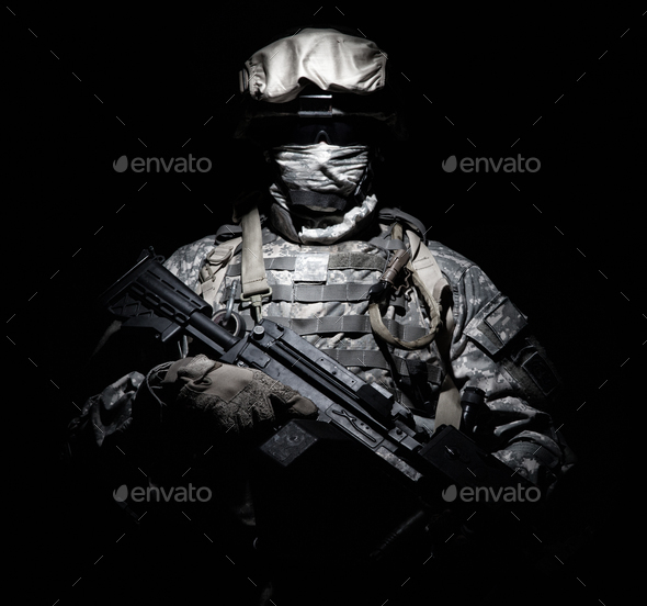 Infantry with machine gun standing in darkness - Stock Photo - Images