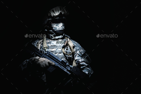 Infantry with machine gun standing in darkness - Stock Photo - Images