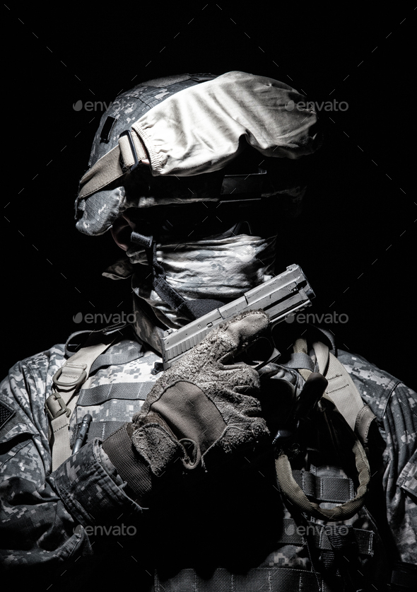 Portrait of commando with service pistol in hand - Stock Photo - Images