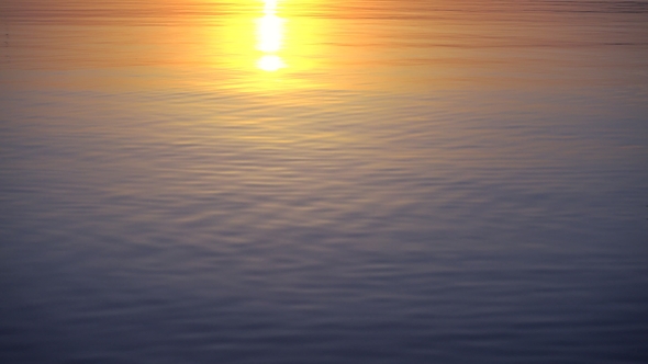 Beautiful Sunset Reflects in Calm Water Surface