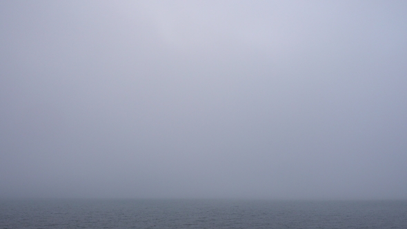Thick Fog Over Morning Calm Water Surface, Looped Video
