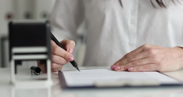 Businesswoman Signs Contract and Puts Seal Slow Motion  Movie alt