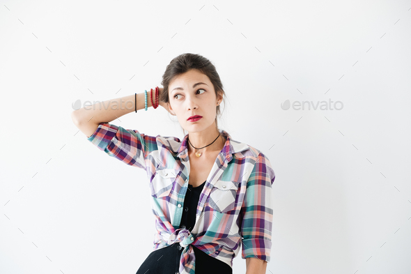 Thoughtful woman studio shot - Stock Photo - Images