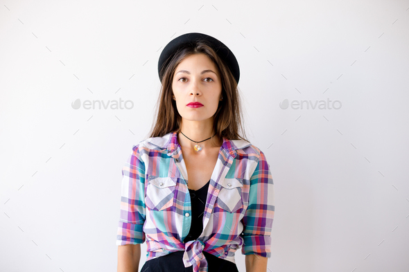 Studio portrait of serious hipster girl - Stock Photo - Images