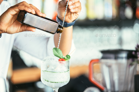 Hands of a bartender pouring alcohol - Stock Photo - Images