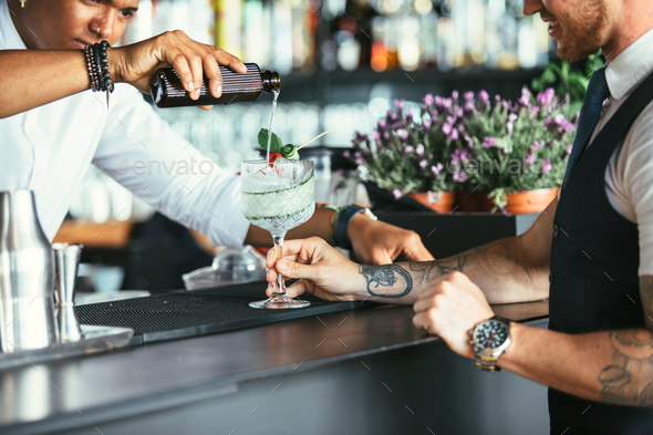 Serving cocktail at the bar counter - Stock Photo - Images