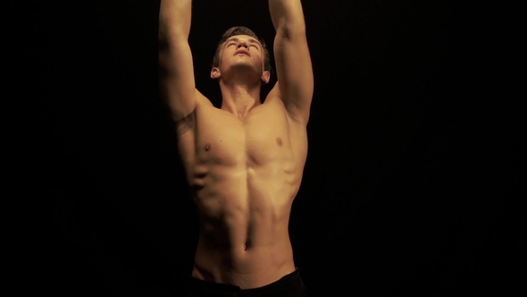 Sexy Man Dance on Black Background alt