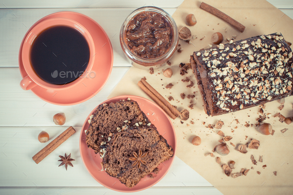 Vintage photo, Dark cake with chocolate, cocoa and plum jam, cup of coffee, delicious dessert - Stock Photo - Images