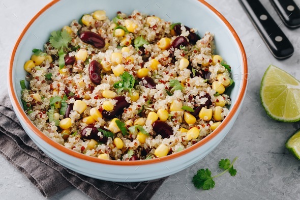 Quinoa salad with sweet corn, black beans and cilantro. Stock Photo by nblxer