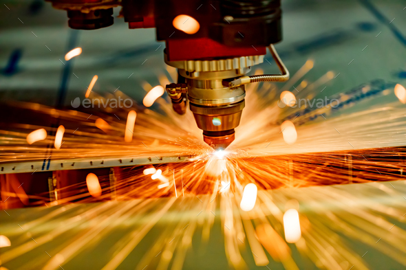 CNC Laser cutting of metal, modern industrial technology. Stock Photo by cookelma