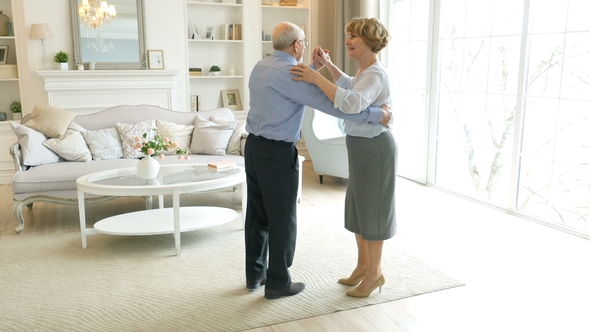 Old Retired People and Leisure Activities, Happy Senior Couple Dancing Valse for Fun at Living Room alt