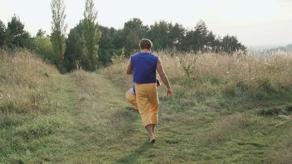 Two Men Practising Free Fight on the Nature alt