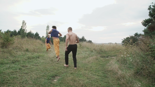 Two Men Practising Free Fight on the Nature. alt