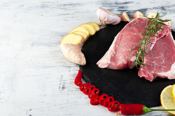 Raw pork meat with spice ingredient - Stock Photo - Images