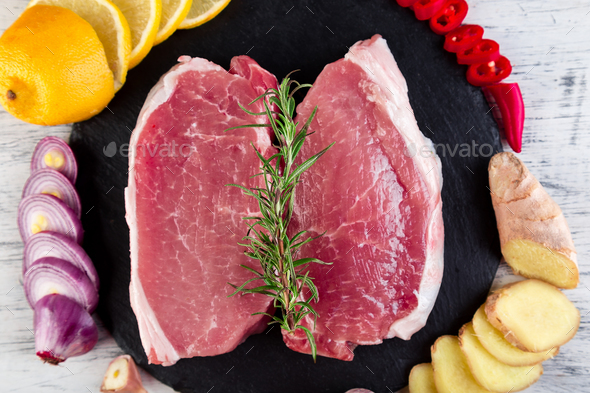 Raw pork meat with spice ingredient - Stock Photo - Images