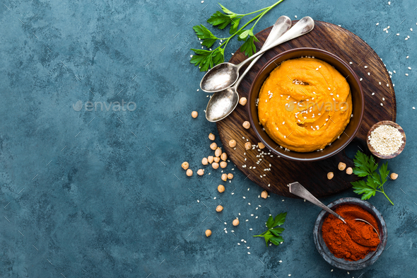 Hummus. Fresh homemade hummus with paprika - Stock Photo - Images