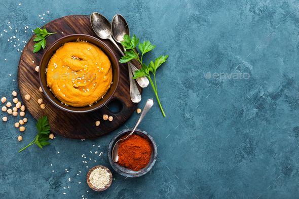 Hummus. Fresh homemade hummus with paprika - Stock Photo - Images