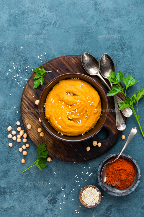 Hummus. Fresh homemade hummus with paprika - Stock Photo - Images
