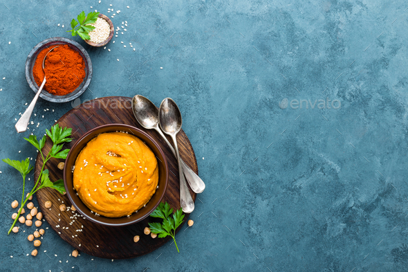 Hummus. Fresh homemade hummus with paprika - Stock Photo - Images
