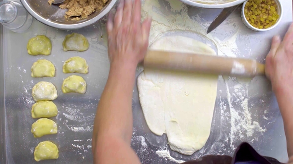Handheld Shot of Female Hands Mixing Sticky Dough alt