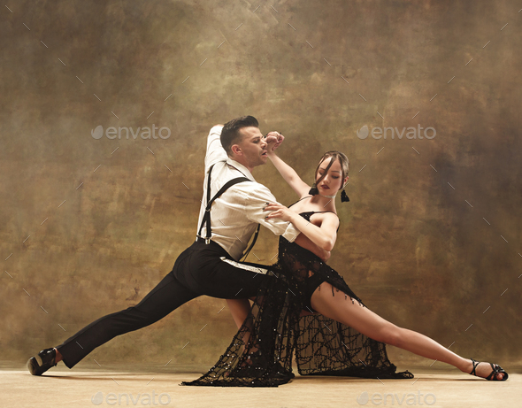 Flexible young modern dance couple posing in studio. Stock Photo by master1305