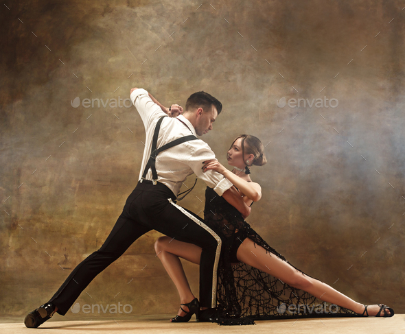 Flexible young modern dance couple posing in studio. Stock Photo by master1305