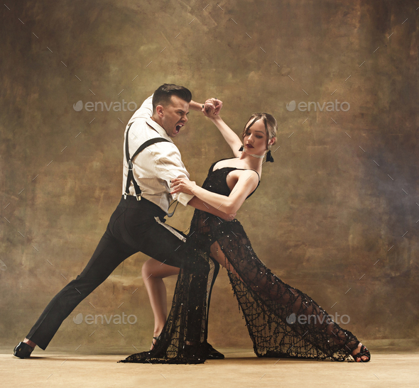 Flexible young modern dance couple posing in studio. - Stock Photo - Images