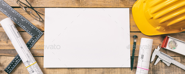 White blank paper, project construction blueprints and engineering tools on wooden desk, copy space - Stock Photo - Images