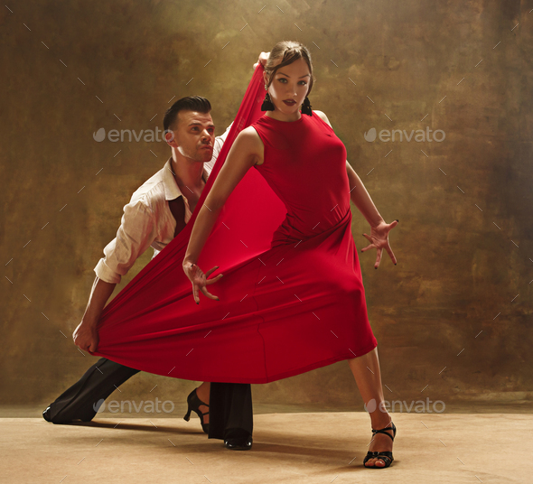 Flexible young modern dance couple posing in studio. - Stock Photo - Images