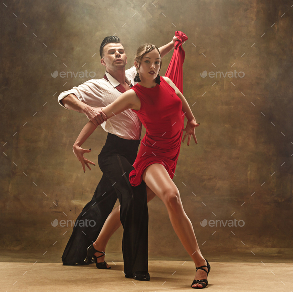 Flexible young modern dance couple posing in studio. - Stock Photo - Images