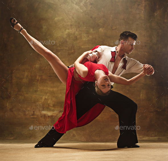 Couple dancers posing over white background. Dance school concept Stock  Photo - Alamy