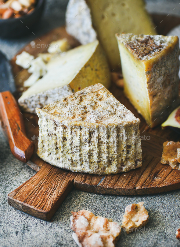 Cheese assortment on board, close-up, vertical composition - Stock Photo - Images