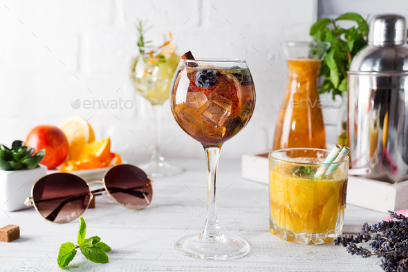 A glass of cocktail and a glass with an orange cocktail or fresh and tonic - Stock Photo - Images