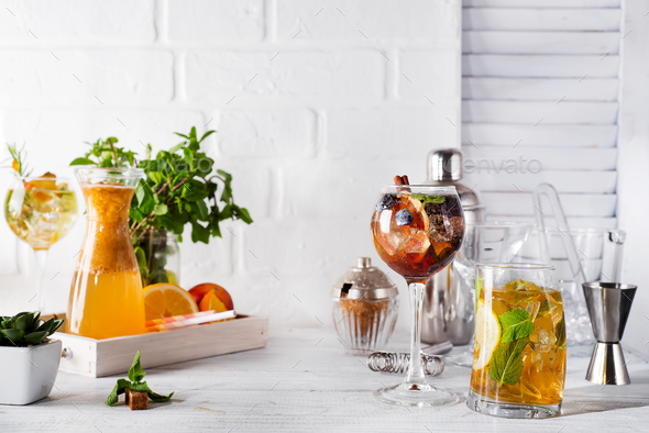 lemonade in the decanter on a wooden tray and Cocktail shaker for preparing a summer cocktail - Stock Photo - Images