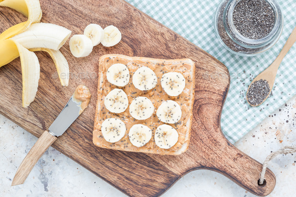 Healthy sandwich with crunchy peanut butter, banana and chia see - Stock Photo - Images