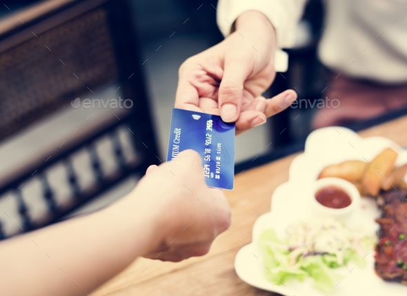 Woman paying lunch with credit card at restaurant Stock Photo by Rawpixel