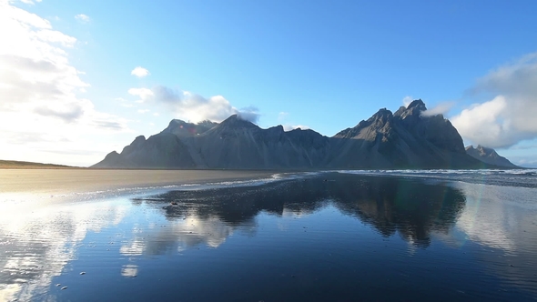 Amazing Mountains Reflected in the Water at Sunset. Stoksnes, Iceland
