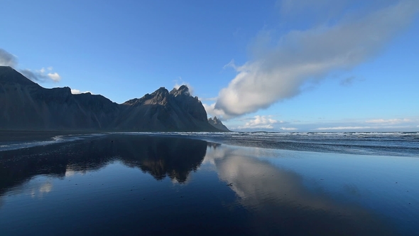 Amazing Mountains Reflected in the Water at Sunset. Stoksnes, Iceland